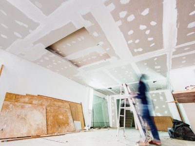Interior worker working on the ceiling, shot with slow speed shutter